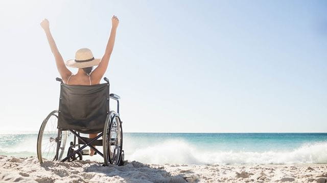 Six of the best European travel destinations woman in wheelchair on beach